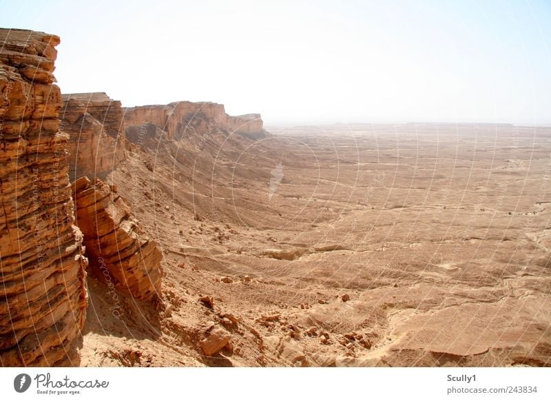 Edge of the world Saudi Arabia Nature Landscape Earth Sand Climate Drought Mountain Canyon Desert Looking Stand Old Far-off places Gigantic Infinity Hot Gloomy