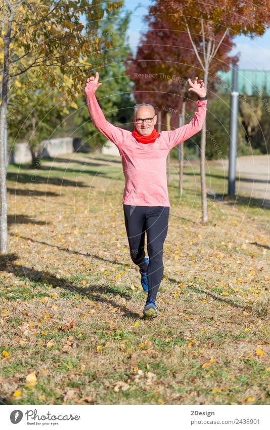 Senior runner man arms up after running Lifestyle Joy Happy Body Leisure and hobbies Sports Success Human being Masculine Man Adults Male senior Arm 1