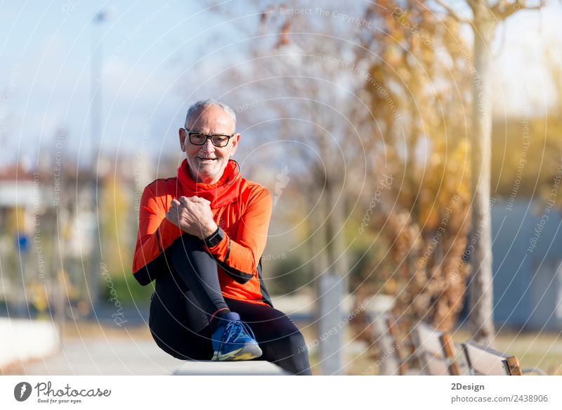 Senior runner man sitting after jogging in a park Lifestyle Happy Relaxation Calm Leisure and hobbies Summer Music Sports Jogging Human being Masculine Man
