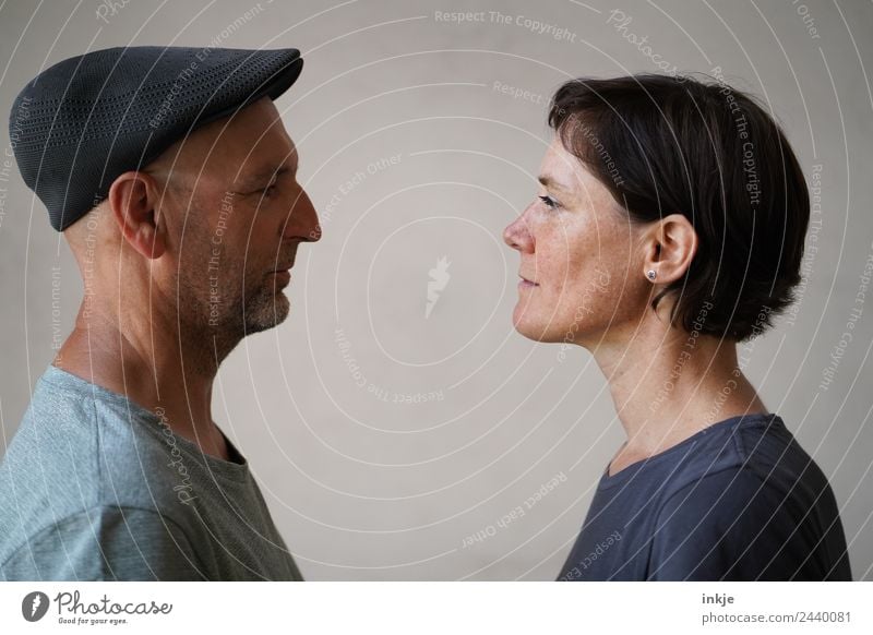 Man and woman face each other Together Attachment Woman Adults Looking Looking into the camera Face to face Bright background Profile portrait 2 Couple