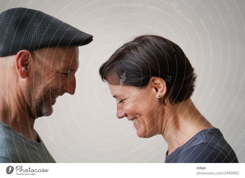 Couple faces each other and laughs Lifestyle Style Joy luck Harmonious Leisure and hobbies Woman Adults Man Friendship Partner Face 2 Human being 30 - 45 years