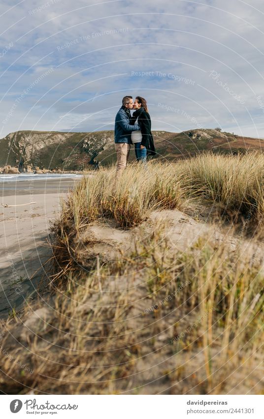 Couple kissing on the beach Lifestyle Calm Leisure and hobbies Beach Ocean Waves Winter Woman Adults Man Parents Family & Relations Nature Landscape Sand Autumn