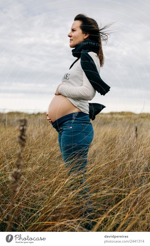 Pregnant woman caressing her naked tummy Lifestyle Human being Baby Woman Adults Mother Family & Relations Nature Landscape Horizon Wind Grass Meadow Scarf