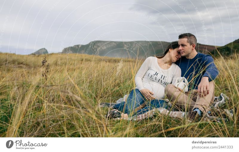Pregnant with partner resting on the meadow Lifestyle Relaxation Human being Baby Woman Adults Man Father Family & Relations Couple Nature Landscape Autumn