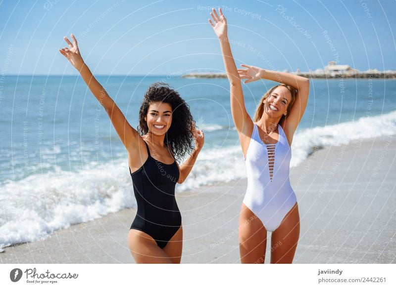 Two women in swimwear on a tropical beach. Joy Beautiful Body Vacation & Travel Tourism Summer Beach Ocean Human being Feminine Young woman Youth (Young adults)