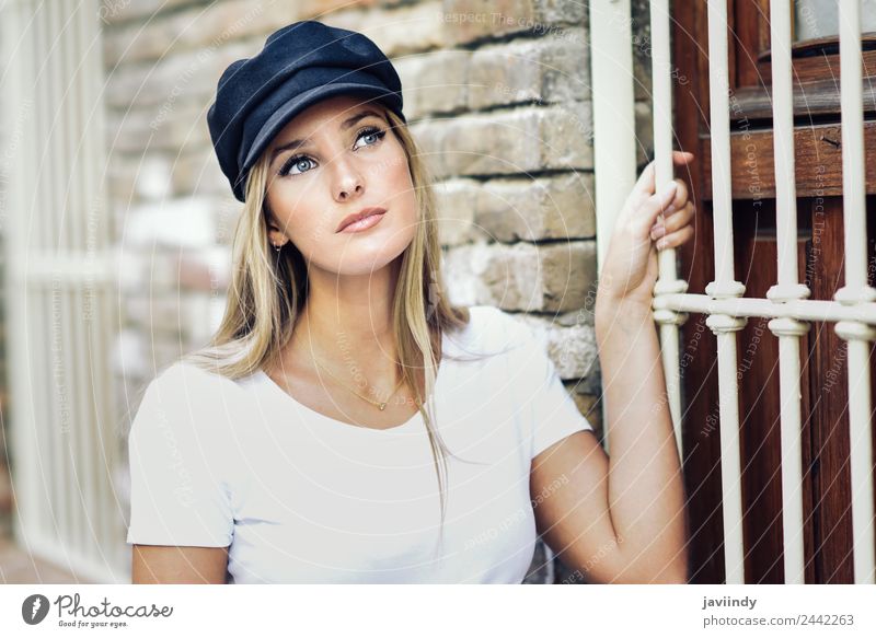 Young blonde woman standing near a brick wall. Lifestyle Style Beautiful Hair and hairstyles Summer Human being Feminine Young woman Youth (Young adults) Woman