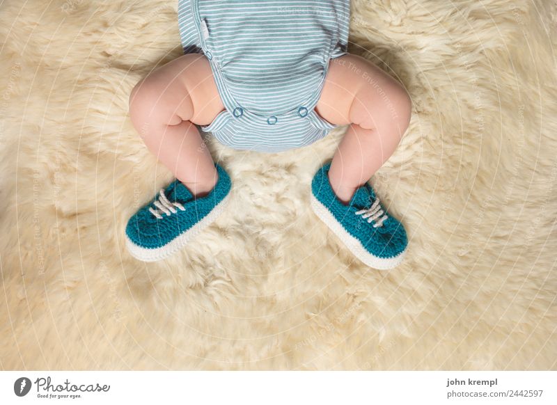 on a large foot Human being Masculine Baby Legs Feet 1 0 - 12 months rompers Footwear Slippers Sheepskin Lie Sleep Healthy Happy Positive Green Turquoise