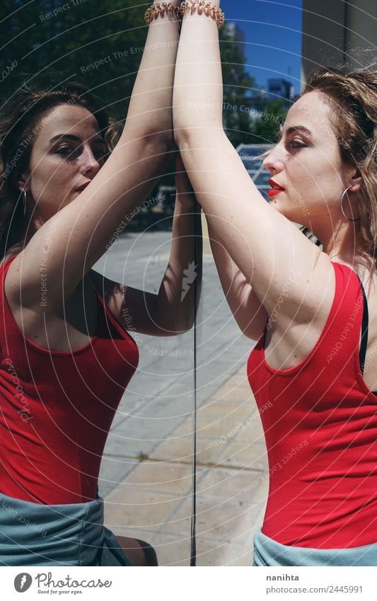 Side portrait of a young woman posing against a mirror wall Lifestyle Elegant Style Design Beautiful Summer Sun Human being Feminine Young woman