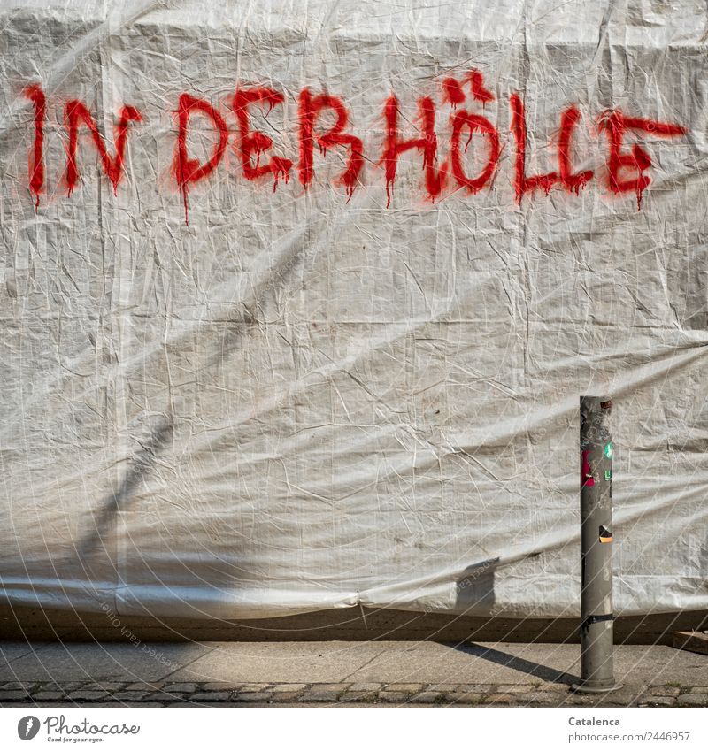 Burn in hell | UT Dresden, graffiti on plastic tarp Town High-rise Facade Pedestrian Sidewalk plastic foil tarpaulin plastic tarpaulin Scaffold Metal Characters