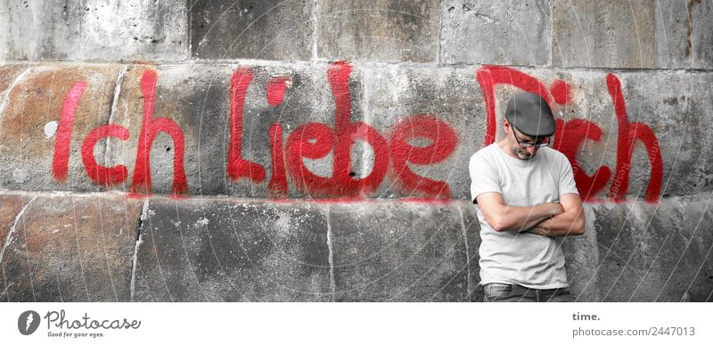 UT Dresden. We love you too. Masculine Man Adults 1 Human being Wall (barrier) Wall (building) T-shirt Eyeglasses Cap Characters Graffiti To hold on Stand Wait