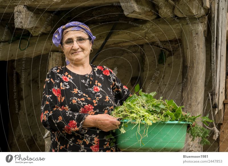 Portrait of an elderly woman picking a vegetable tub Food Vegetable Nutrition Organic produce Vegetarian diet Diet Lifestyle Style Healthy Eating