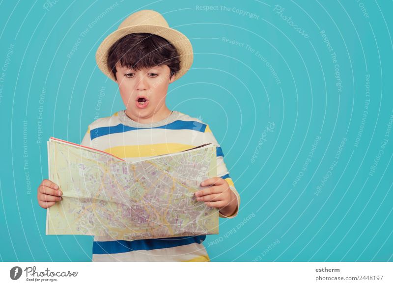 boy with hat and map on blue background Lifestyle Vacation & Travel Tourism Trip Adventure Sightseeing City trip Summer vacation Human being Masculine Child