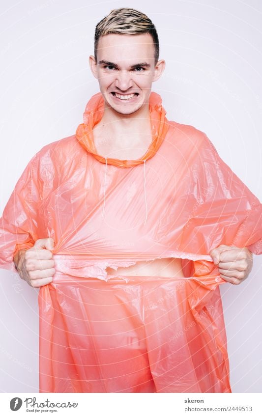 young guy in a pink plastic raincoat Fitness Sports Training Sportsperson Human being Masculine Young man Youth (Young adults) Adults Body Face Eyes Ear Lips