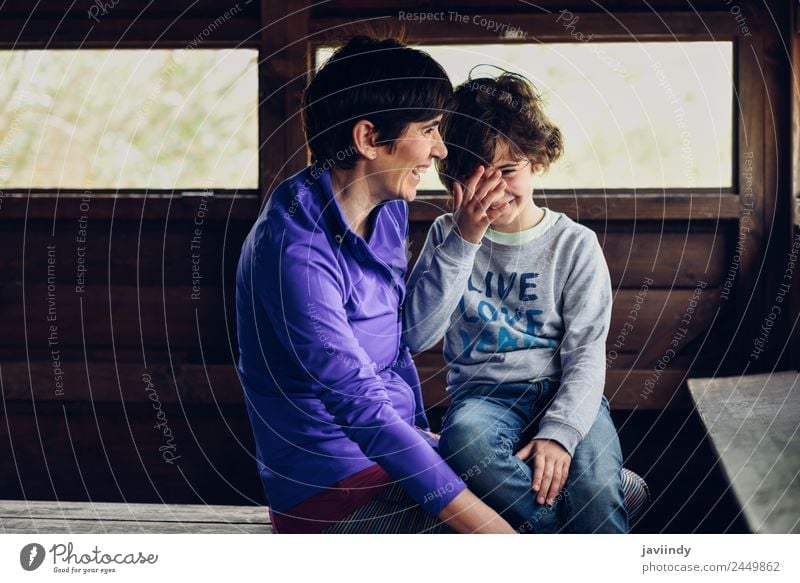 Mother with her seven year old daughter laughing in a cabin in the countryside. Joy Child Human being Girl Woman Adults Family & Relations Infancy 2 3 - 8 years
