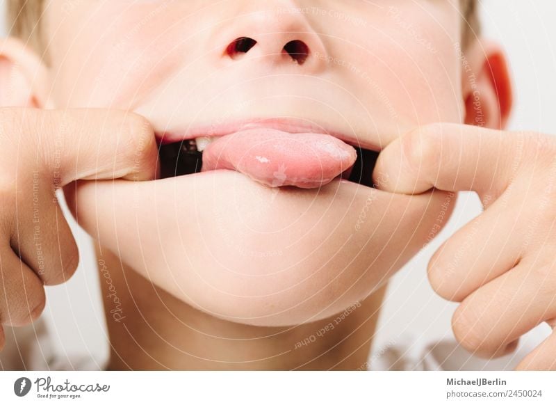 Boy of primary school age fooling around Joy Playing Masculine Child Boy (child) Infancy 1 Human being 3 - 8 years Funny Toddler Tongue Colour photo Close-up