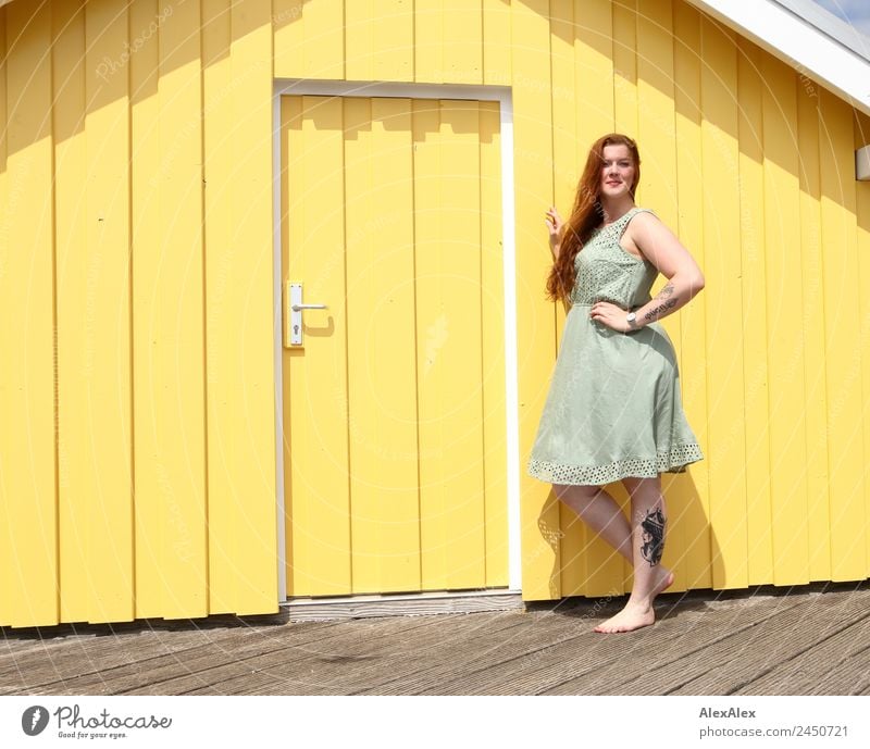 Woman in front of a yellow beach house Lifestyle Style Beautiful Harmonious Well-being Wooden house Young woman Youth (Young adults) Adults 18 - 30 years Summer