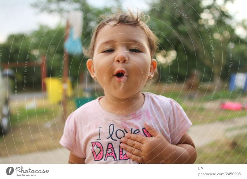 small child making a face at the camera wearing a I love dad tshirt Parenting Education Human being Child Young woman Youth (Young adults) Parents Adults Father