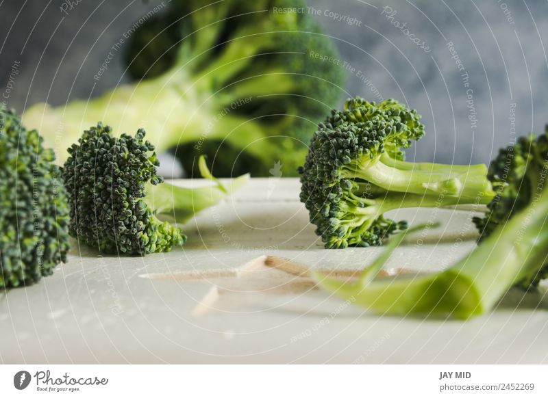 Small pieces of raw broccoli on white wood, Close up Broccoli Raw Food Healthy Eating Dish Piece Detail Fresh Green Diet Vegetable Organic Natural Ingredients
