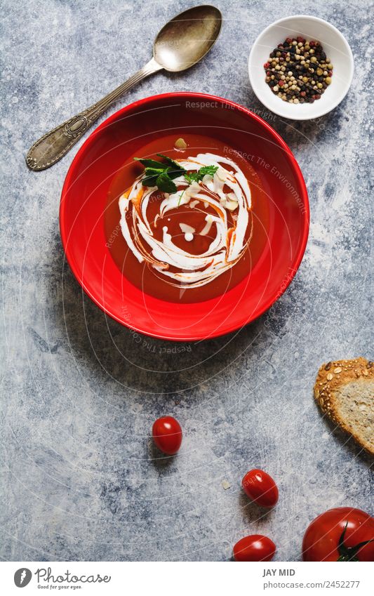 tomato cream soup in red bowl on grunge background Soup Tomato Cream Dish Red Healthy Eating Vegetarian diet Meal Pepper Herbs and spices Parsley oil olive