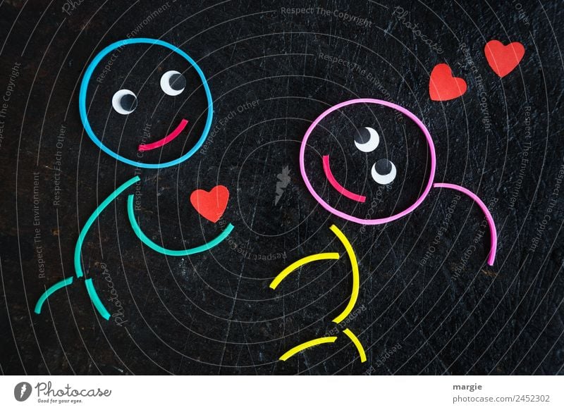 Rubber worms: declaration of love Masculine Feminine Girl Boy (child) Eyes 2 Human being Multicoloured Red Black Emotions Anticipation Trust Agreed Friendship