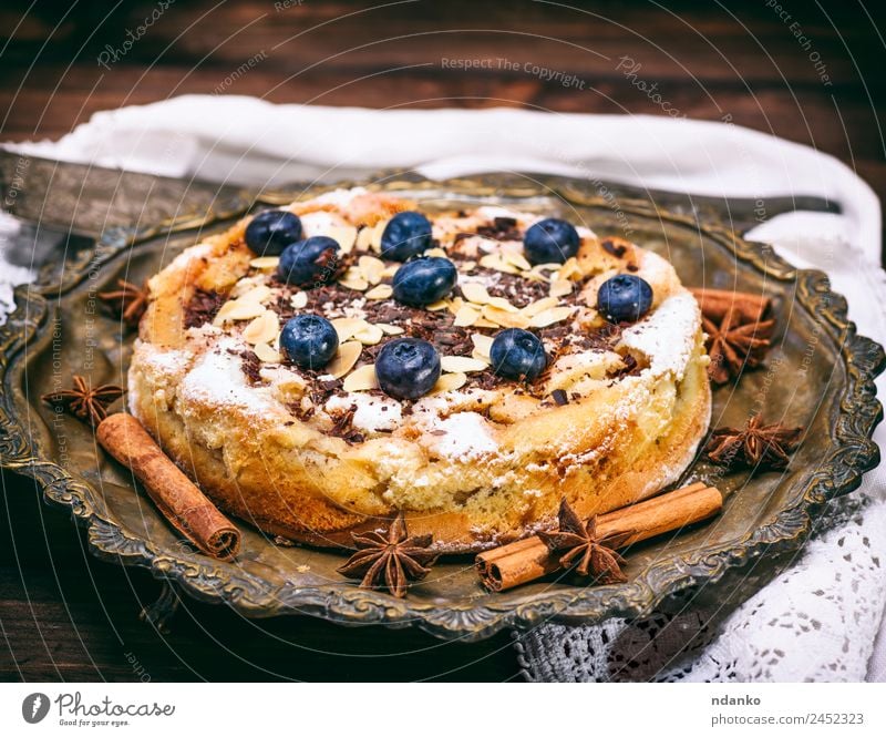 round homemade pie with blueberries Fruit Dessert Candy Plate Table Wood Eating Delicious Blue Brown Pie Blueberry background tart Home-made food sweet Snack