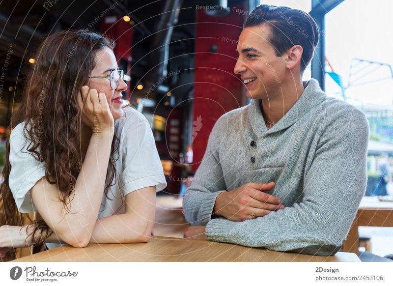 Side view of loving couple looking at each other Lunch Coffee Lifestyle Happy Beautiful Leisure and hobbies Table Restaurant Flirt To talk Human being Masculine