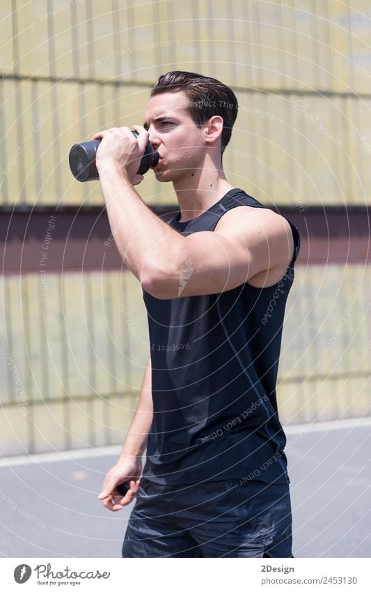 Young sportsman drinking water after jogging Drinking Bottle Lifestyle Summer Sports Jogging Human being Masculine Young man Youth (Young adults) Man Adults 1