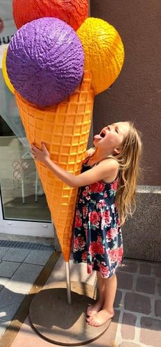 Girl with ice Child Family & Relations 1 Human being 3 - 8 years Infancy Summer Beautiful weather Dress Blonde Long-haired Sphere Touch Eating