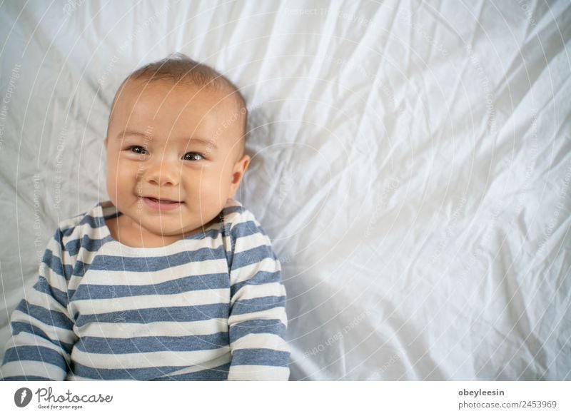 Portrait of a crawling baby on the bed in his room Joy Happy Beautiful Face Life Child Human being Baby Toddler Boy (child) Man Adults Infancy Smiling Laughter