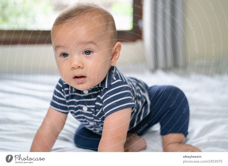 Portrait of a crawling baby on the bed in his room Happy Beautiful Face Bathroom Child Human being Baby Toddler Boy (child) Woman Adults Infancy Toys Smiling