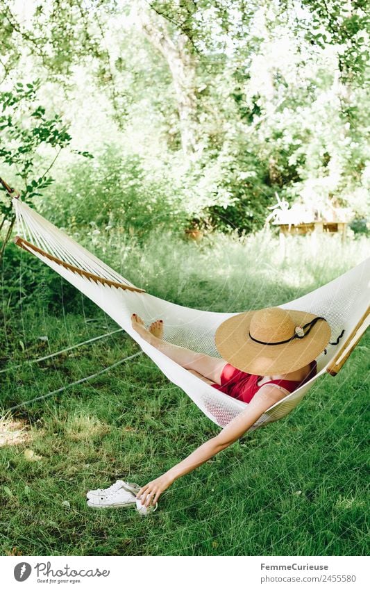 Young woman relaxing in a hammok Lifestyle Feminine Youth (Young adults) Woman Adults 1 Human being 18 - 30 years 30 - 45 years Relaxation Hammock Sunhat Dress