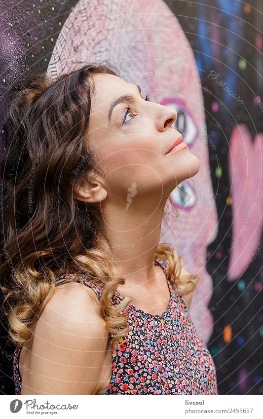 Thoughtful woman leaning on a wall with graffiti Lifestyle Happy Beautiful Face Relaxation Calm Human being Feminine Woman Adults Female senior Head 1