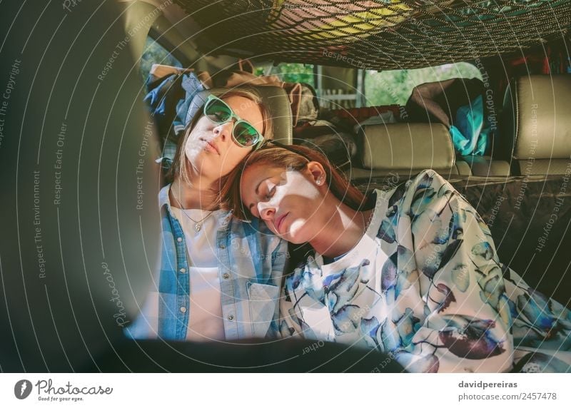 Tired women friends sleeping in a rear seat car Lifestyle Beautiful Relaxation Leisure and hobbies Vacation & Travel Trip Adventure Human being Woman Adults