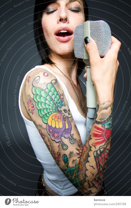 colored voices Human being Feminine Woman Adults Punk Concert Singer Tattoo Emotions Colour Tattooed Dye Gaudy Microphone Song youthful Rock music Rocker