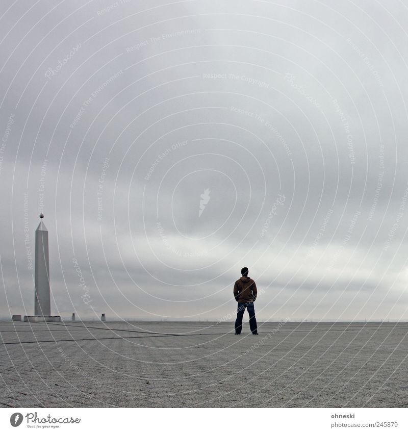alone in the hall Human being Masculine Man Adults 1 Clouds Bad weather Halde Hoheward Manmade structures Tourist Attraction Obelisk Think Looking Stand Dark