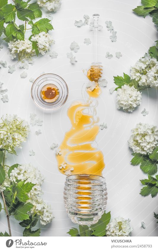 Flowing honey with flowers and honey spoon Food Nutrition Organic produce Vegetarian diet Diet Crockery Style Design Healthy Alternative medicine Healthy Eating