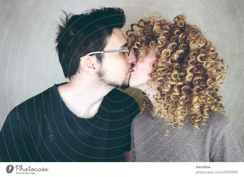 Young couple kissing in a studio portrait Lifestyle Joy Hair and hairstyles Wellness Well-being Senses Human being Masculine Feminine Woman Adults Man