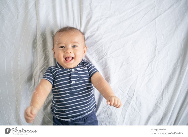 The little boy smiles in the bed in his own room Joy Happy Beautiful Face Life Child Human being Baby Toddler Boy (child) Man Adults Infancy Smiling Laughter