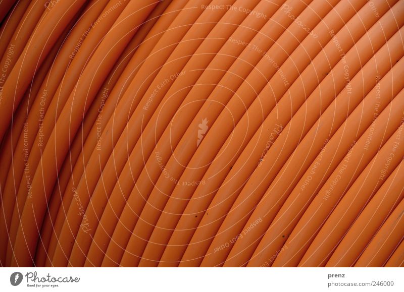 plastic design Plastic Brown Pipe Transmission lines Cable Line Wound up Colour photo Exterior shot Close-up Light Shallow depth of field Central perspective