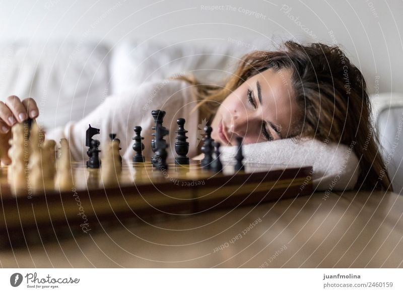 Woman at home playing chess alone Lifestyle Elegant Style Happy Beautiful Face Leisure and hobbies Playing Chess House (Residential Structure) Dream house Sofa