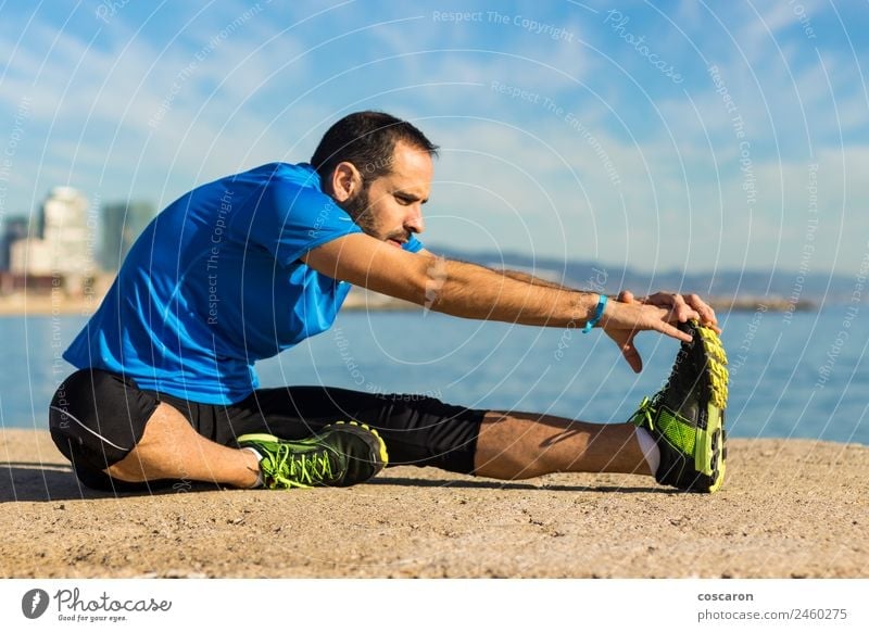 Jogger stretching in the morning on seaside. Lifestyle Body Wellness Relaxation Freedom Beach Ocean Sports Man Adults Nature Horizon Coast Beard Fitness