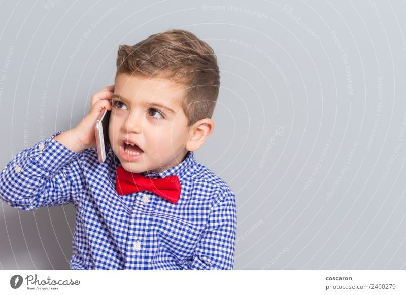 Little boy talking on the phone with copy space Joy Happy Beautiful Face Child To talk Telephone Cellphone PDA Technology Human being Toddler Boy (child) Man