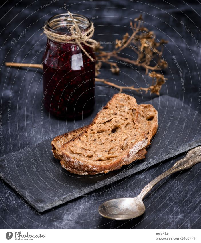 rye bread and a jar of raspberry jam Bread Candy Jam Breakfast Spoon Eating Black Rye piece food background glass sweet Colour photo Deserted