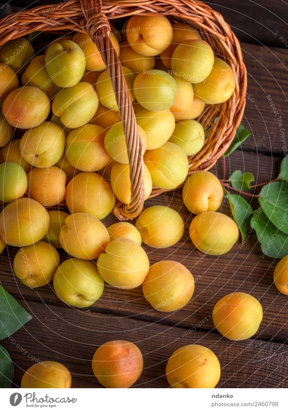 Ripe apricots Fruit Nutrition Vegetarian diet Diet Table Group Nature Leaf Wood Eating Fresh Natural Juicy Brown Yellow Colour Basket agriculture Apricot