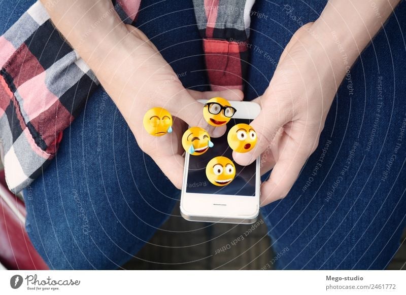 Close-up of woman using smartphone sending emojis. Lifestyle Happy Face Telephone PDA Screen Technology Internet Human being Man Adults Hand Funny Modern Smart