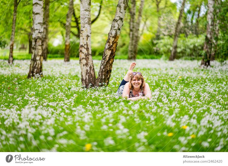young woman on a flowering meadow in a birch forest Day Forest Meadow Birch tree Blossom Blossoming Flower Green Nature Spring Animal 1 Person Young woman Lie