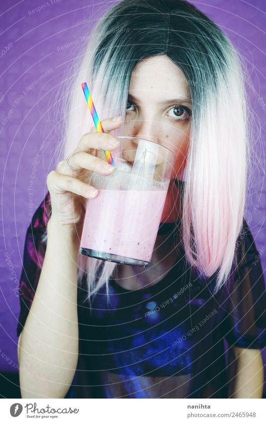 Young fit woman drinking a pink smoothie Fruit Beverage Drinking Cold drink Juice Milk Milkshake Glass Lifestyle Style Design Hair and hairstyles Skin Face