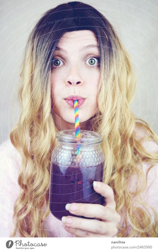 Beautiful young woman drinking a blueberry smoothie Fruit Nutrition Vegetarian diet Beverage Drinking Cold drink Juice Milkshake Lifestyle Style Healthy