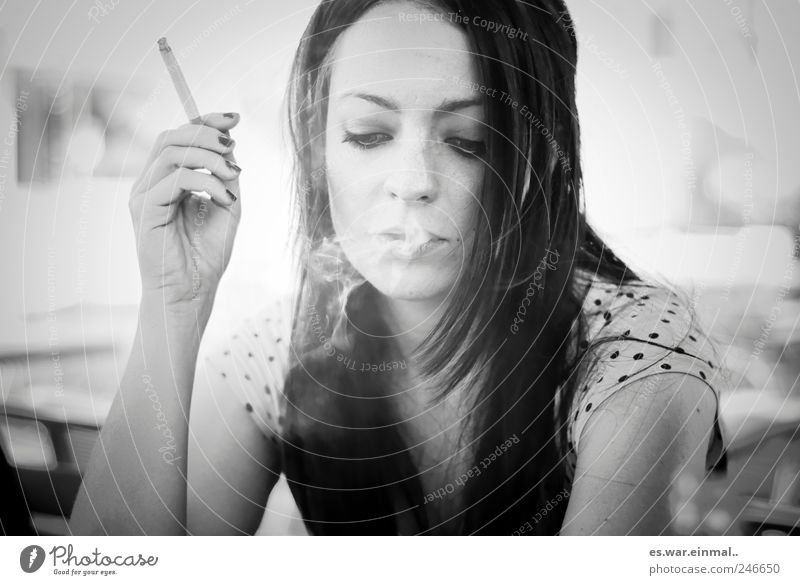 rest phase. Feminine Face Smoking Beautiful Caution Serene Calm Colour photo