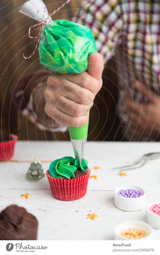 Making cupcake for christmas time Dessert Decoration Christmas & Advent Tree Green Red White background Baking box Butter Card copy cream Cupcake Festive food
